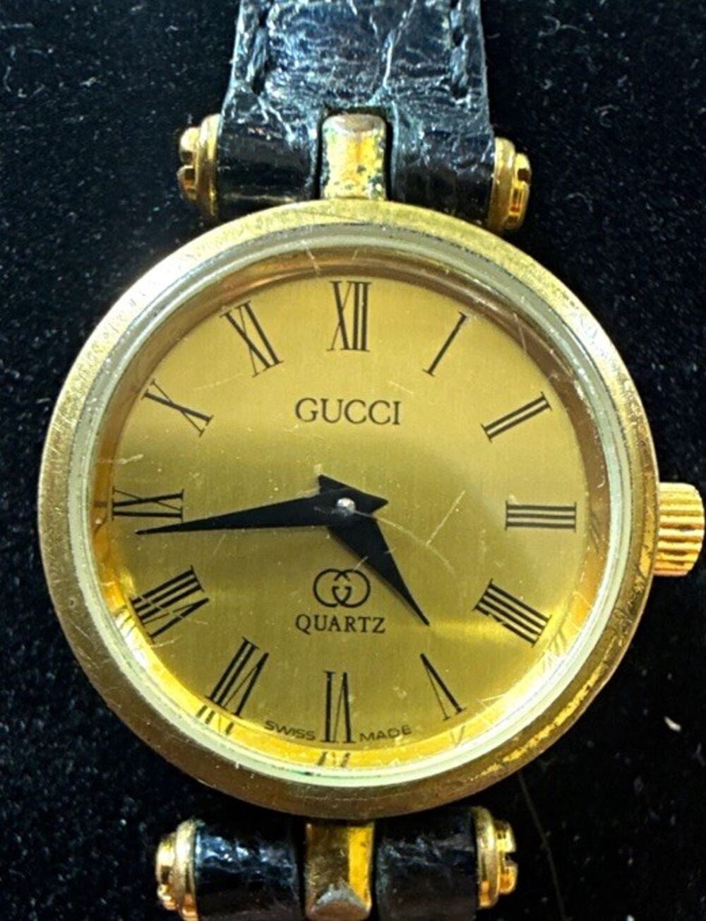 Gucci 2000L Women’s Swiss Made Quartz Analog Gold Dial Black Leather Watch